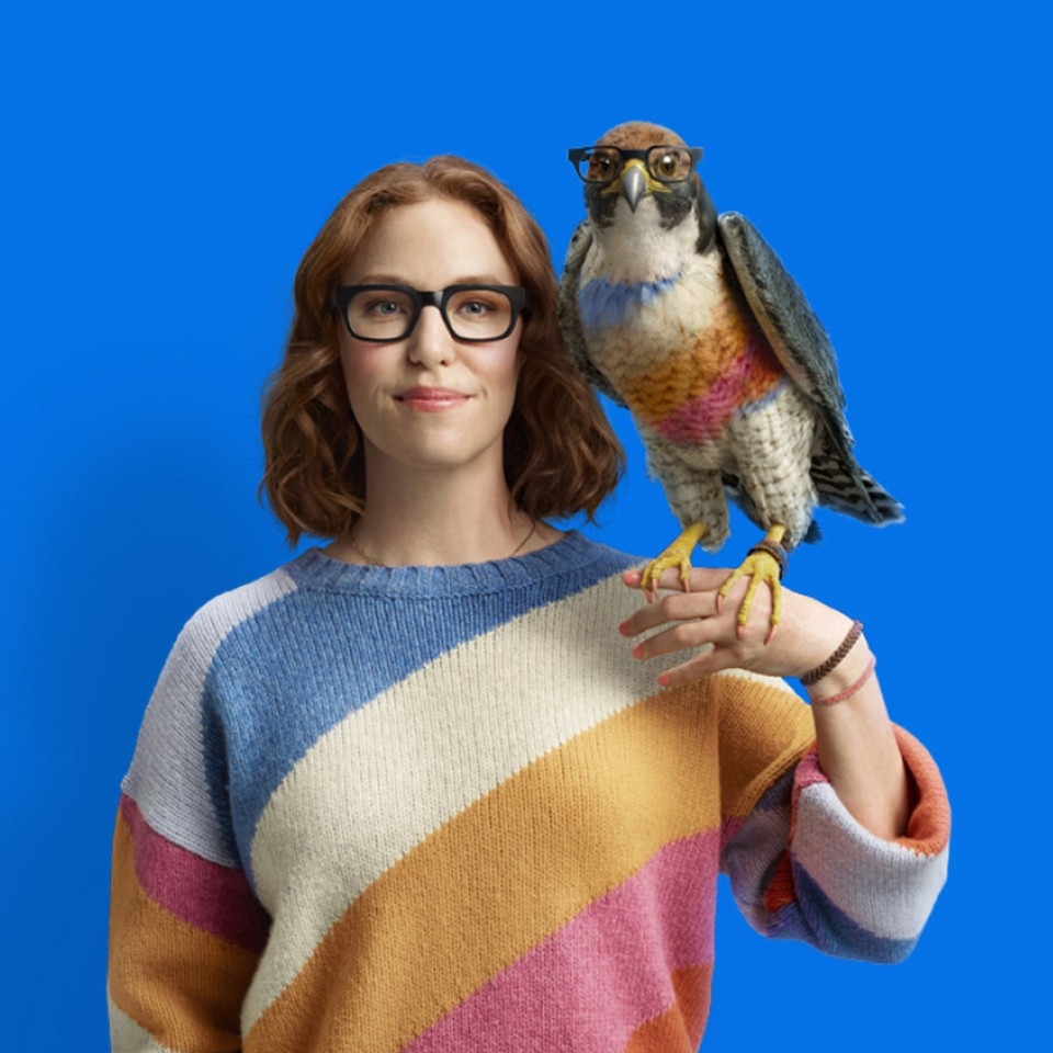 women holding falcon